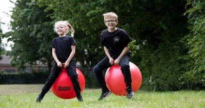 Children on space hoppers nr