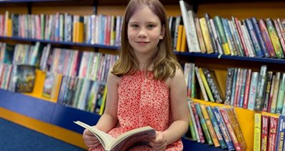 Maria enjoying the Summer Reading Challange NR